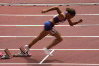 Sydney Mclaughlin, of United States, wins a heat in the women's 400-meter hurdles at the 2020 Summer Olympics, Saturday, July 31, 2021, in Tokyo. (AP Photo/Charlie Riedel)