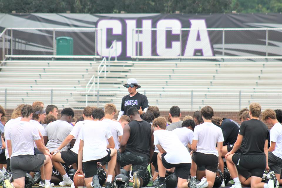 First-year head coach Calvin Renfroe talks to his team after practice as Cincinnati Hills Christian Academy had football practice July 17, 2023.