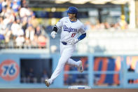 Los Angeles Dodgers designated hitter Shohei Ohtani (17) runs the bases after hitting a home run during the third inning of a baseball game against the Atlanta Braves in Los Angeles, Saturday, May 4, 2024. (AP Photo/Ashley Landis)