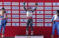 Alpine Skiing - FIS Alpine Skiing World Championships - Women's Giant Slalom - St. Moritz, Switzerland - 16/2/17 - Gold medalist Tessa Worley of France is flanked by silver medalist Mikaela Shiffrin (L) of the USA and Italy's bronze medal winner Sofia Goggia during the flower ceremony. REUTERS/Ruben Sprich