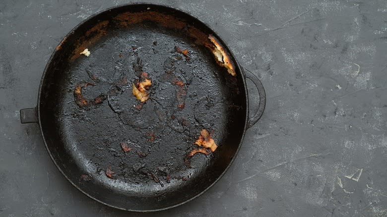 Top-down view of a dirty cast iron pan
