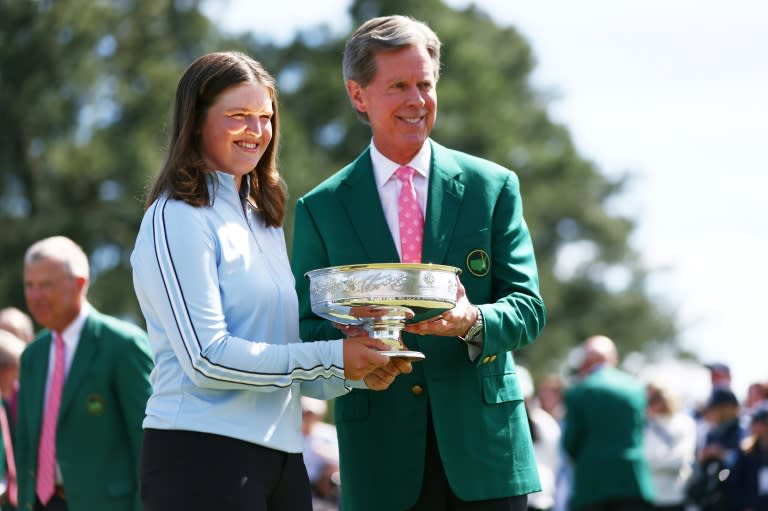 Augusta National chairman Fred Ridley presents Lottie Woad of England with the trophy following the final round of the Augusta National Women's Amateur at Augusta National Golf Club. (Maddie Meyer)