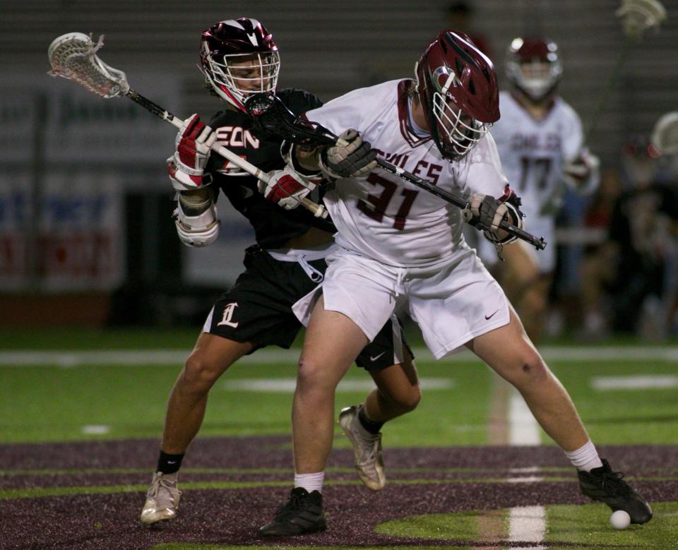 Chiles sophomore Tren Harrison (31) battles in a faceoff in a game against Leon on April 12, 2022, at Chiles High School. The Timberwolves won 9-6.