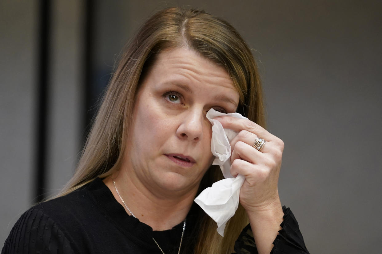 Gabby Petito's mother Nichole Schmidt, wipes a tear from her face during a news conference Thursday, Nov. 3, 2022, in Salt Lake City. Gabby Petito's family filed a wrongful death lawsuit alleging that police failed to recognize their daughter was in a life-threatening situation last year when officers investigated a fight between her and her boyfriend. The fight happened weeks before authorities say the boyfriend killed her while the couple was on a cross-country van trip. (AP Photo/Rick Bowmer)