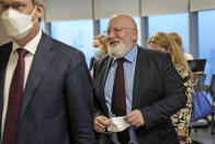 Executive Vice President of European Union Green Deal Frans Timmermans, center, leaves after an interview with The Associated Press in Jakarta, Indonesia, Monday, Oct. 18, 2021. Timmerman urged that developing nations cannot be left behind as the world moves towards greener methods. Timmermans spoke to The Associated Press ahead of the U.N. climate conference in Scotland that starts on October 31. (AP Photo/Dita Alangkara)