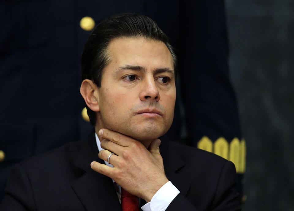 Mexico's President Enrique Pena Nieto pauses during a press conference at Los Pinos presidential residence in Mexico City, Monday, Jan. 23, 2017. Pena Nieto said Monday that Mexico's attitude towards the Donald Trump administration should not be aggressive or biased, but one of dialogue. (AP Photo/Marco Ugarte)