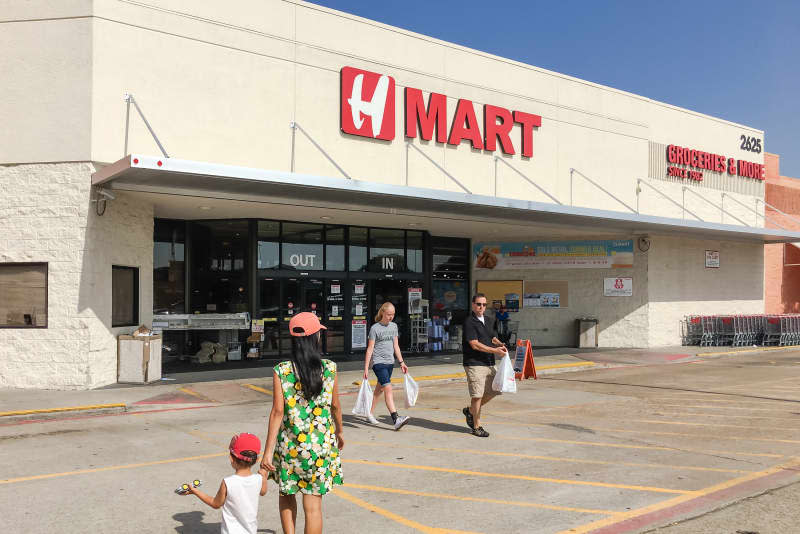 CARROLLTON, TX, US-JUL 1, 2018:Customers enter and exit H Mart supermarket. An American supermarket chain, specializes in providing Asian foods, operated by the Hanahreum Group, Lyndhurst, NJ
