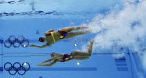 Marie-Pier Boudreau Gagnon and Elise Marcotte of Canada compete during women's duet synchronized swimming preliminary round at the Aquatics Centre in the Olympic Park during the 2012 Summer Olympics in London, Monday, Aug. 6, 2012. (AP Photo/Mark J. Terrill)