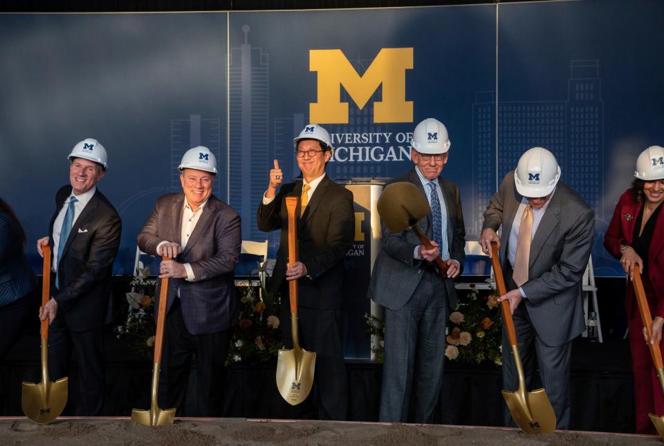 From left to right: Christopher Ilitch, Mayor Mike Duggan, Santa Ono, Stephen Ross, Mark Bernstein and Mary Sheffield hold a shovel during the groundbreaking event for the University of Michigan Center for Innovation in Detroit on Thursday, Dec. 14, 2023.
