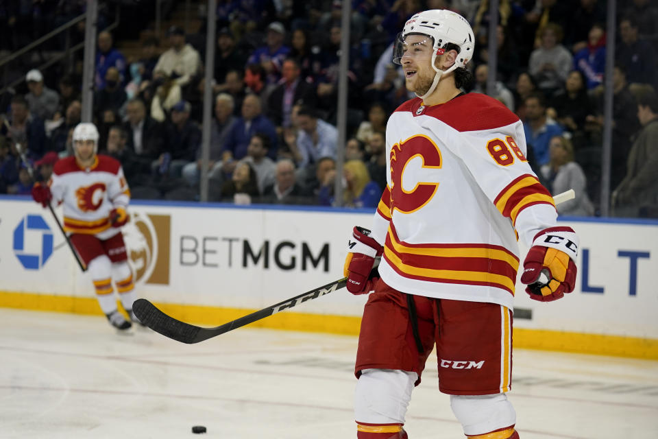 FILE - Calgary Flames left wing Andrew Mangiapane reacts after scoring on New York Rangers goaltender Igor Shesterkin during the second period of an NHL hockey game, Monday, Oct. 25, 2021, in New York. After sitting through 12-plus rounds of the NHL draft over the span of two consecutive summers, Andrew Mangiapane had all but given up on ever hearing his name called. (AP Photo/John Minchillo, File)