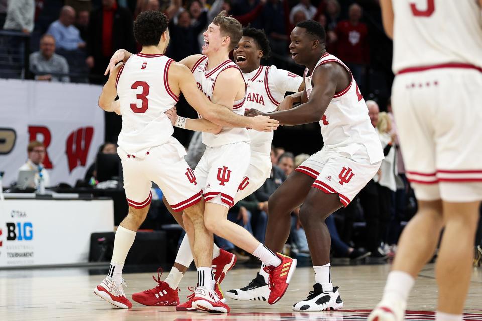 Mar 14, 2024; Minneapolis, MN, USA; Indiana Hoosiers players celebrate the win after the game against the Penn State Nittany Lions at Target Center. Mandatory Credit: Matt Krohn-USA TODAY Sports