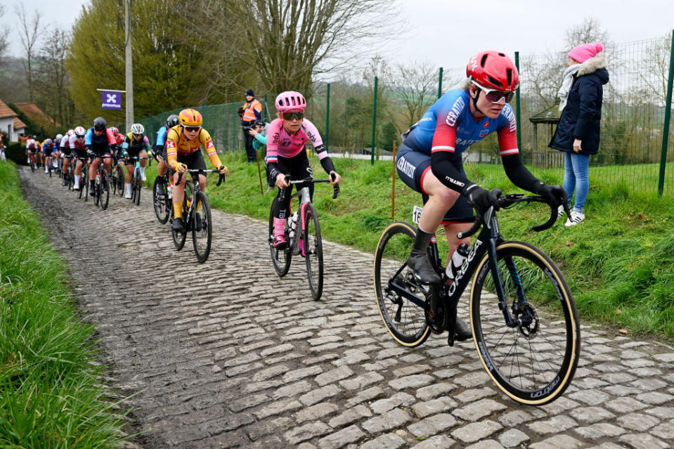 OUDENAARDE BELGIUM  APRIL 02 LR Lauren Stephens of The United States and Team EF EducationTibcoSvb and Marta Lach of Poland and Team CeratizitWNT Pro Cycling compete passing through a cobblestones sector during the 20th Ronde van Vlaanderen  Tour des Flandres 2023 Womens Elite a 1566km one day race from Oudenaarde to Oudenaarde  UCIWWT  on April 02 2023 in Oudenaarde Belgium Photo by Luc ClaessenGetty Images