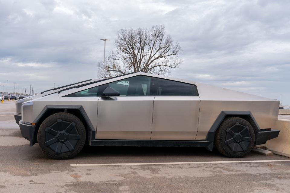 Tesla Cybertrucks are parked outside the company's Giga Texas factory on December 13, 2023, in Austin, Texas.