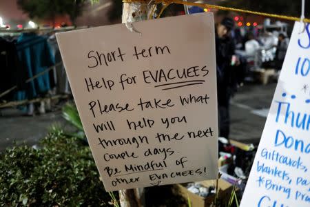 A sign hangs at a makeshift evacuation center for people displaced by the Camp Fire in Chico, California, U.S., November 15, 2018. REUTERS/Terray Sylvester