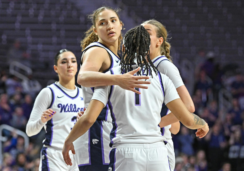 MANHATTAN, KS - JANUARY 10:  Ayoka Lee #50 of the Kansas State Wildcats huddles with her teammates after scoring a basket in the second half against the Oklahoma Sooners at Bramlage Coliseum on January 10, 2024 in Manhattan, Kansas. (Photo by Peter Aiken/Getty Images)