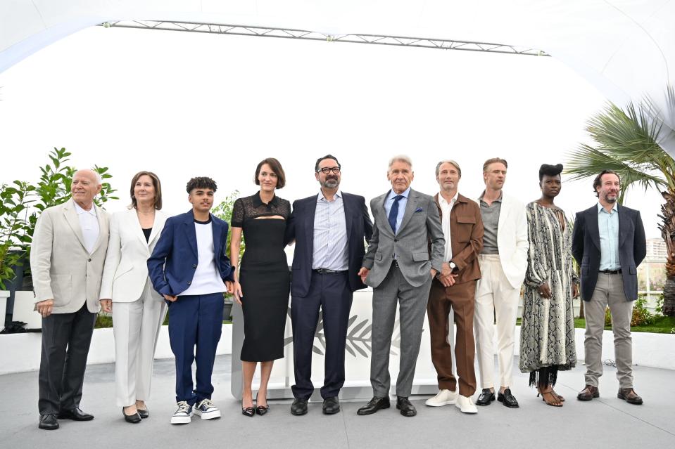 Frank Marshall, Kathleen Kennedy, Ethann Isidore, Phoebe Waller-Bridge, James Mangold, Harrison Ford, Mads Mikkelsen, Boyd Holbrook, Shaunette Renée Wilson and Simon Emanuel attend the "Indiana Jones And The Dial Of Destiny" photocall on May 19, 2023. in Cannes, France.