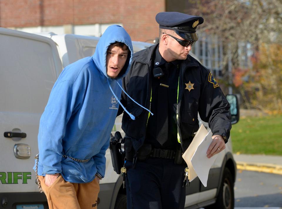 Randy Patterson-Gerber, left, is escorted into Barnstable Superior Court on Monday. A Barnstable grand jury indicted Patterson-Gerber on a charge of first-degree murder in the 2021 death of a six-week-old infant.