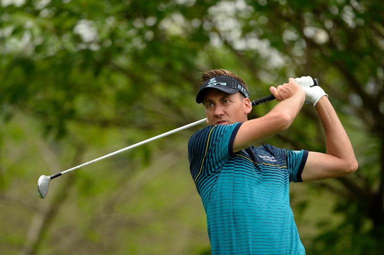 This photo taken by OneAsia on April 23, 2014 shows Ian Poulter of England hitting a shot during the Pro Am competition of the China Open at the Genzon Golf Club in the southern Chinese city of Shenzhen