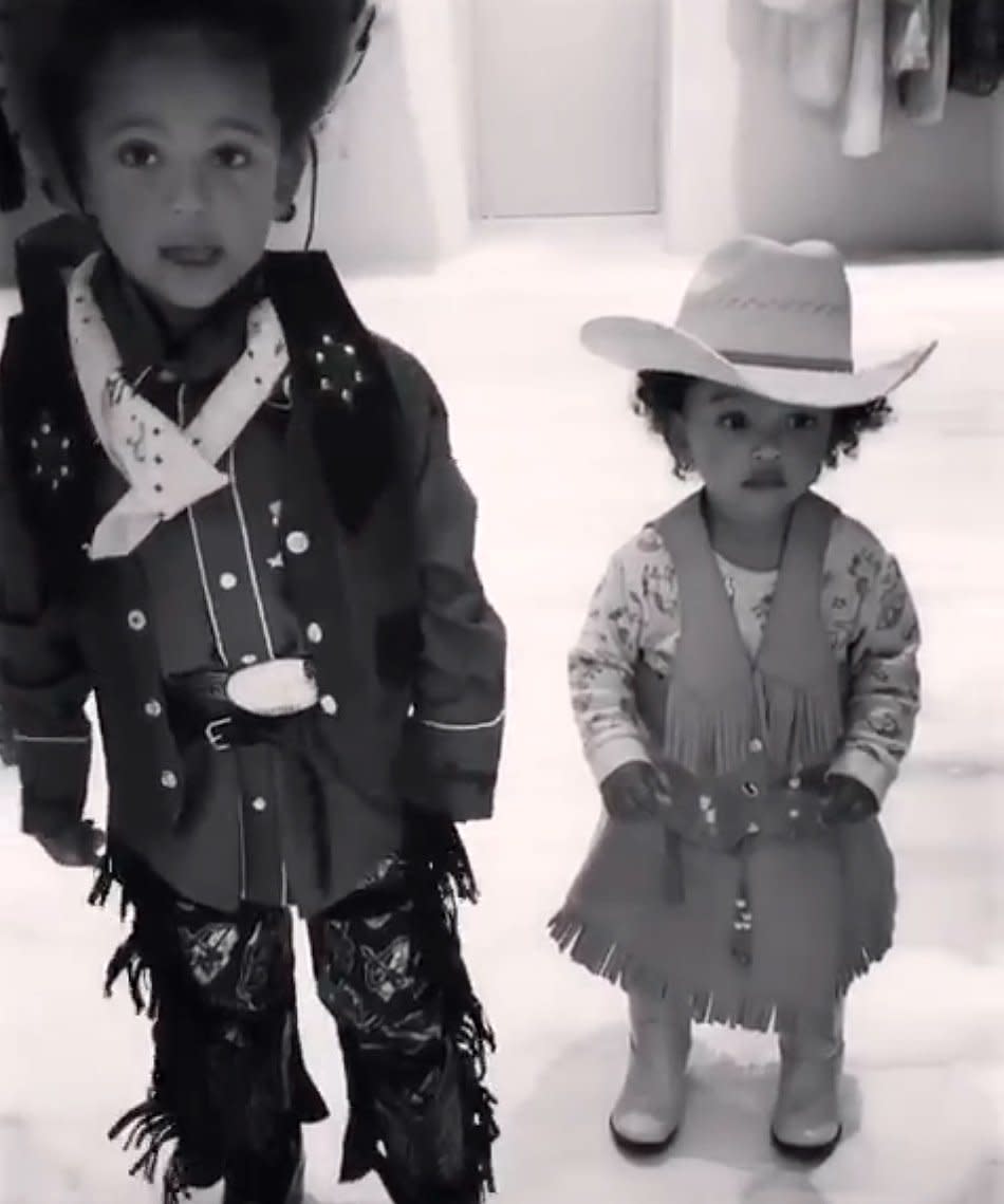 She's always down for some dress-up. Here, she and her brother, Saint, get ready to take their horses up to Old Town Road. 