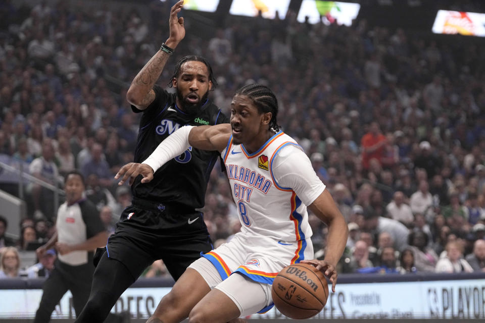 Oklahoma City Thunder forward Jalen Williams (8) works to the basket against Dallas Mavericks forward Derrick Jones Jr., left, in the first half of Game 6 of an NBA basketball second-round playoff series Saturday, May 18, 2024, in Dallas. (AP Photo/Tony Gutierrez)