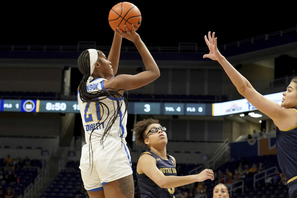 Pittsburgh forward Miliyah Johnson (21) looks to shoot over Notre Dame guard Olivia Miles, second from left, during the first half of an NCCA college basketball game in Pittsburgh, Sunday, Feb. 19, 2023. (AP Photo/Matt Freed)