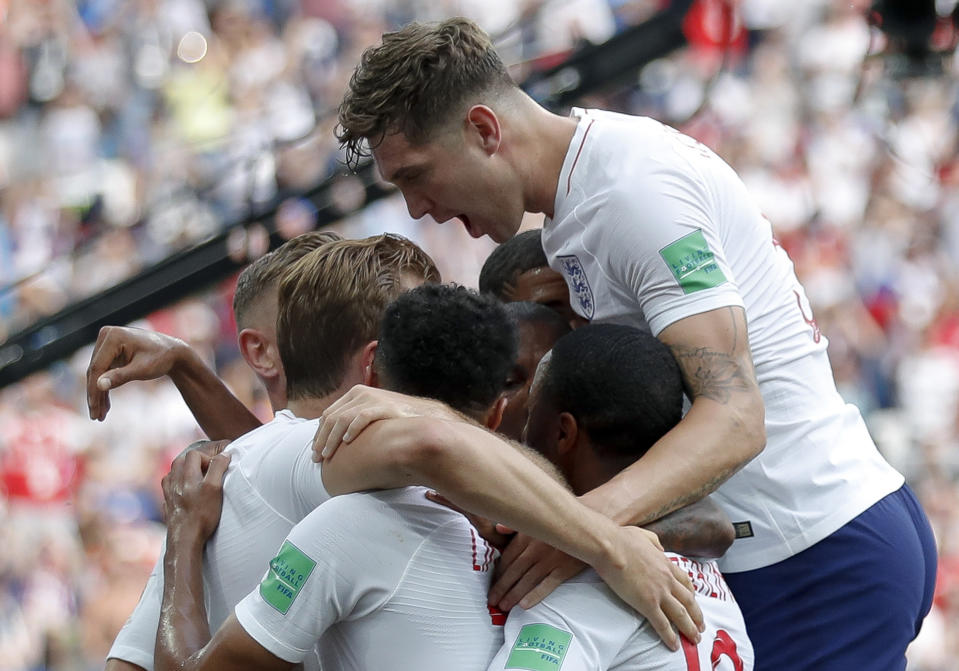 England players celebrate after their teammate Harry Kane scored their side’s second goal. (AP Photo/Antonio Calanni)