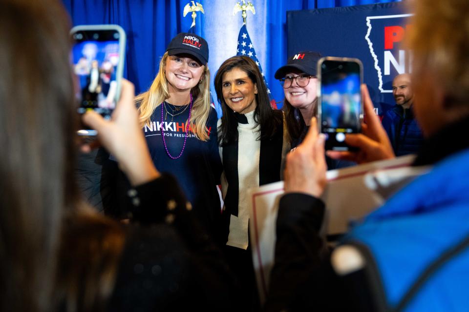 Former U.N. Ambassador Nikki Haley takes photos with supporters after a campaign stop Sunday, Jan. 14, 2024, at Jethro's BBQ in Ames, IA.