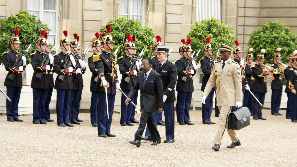 Gabon's then-President Omar Bongo Ondimba with bodyguard Brice Oligui Nguema and French President Nicolas Sarkozy in Paris on July 2, 2008. - Frederic SOULOY/Gamma-Rapho/Getty Images