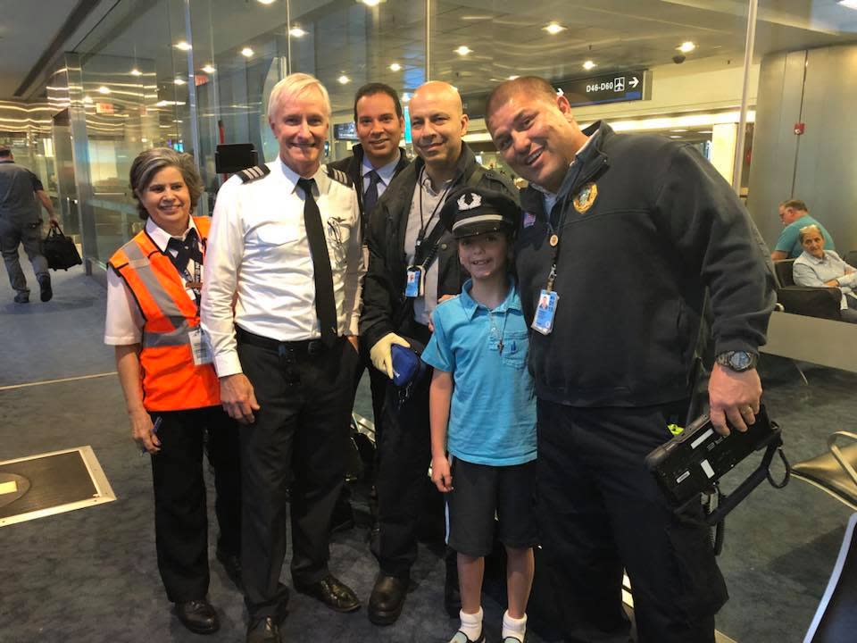 Luca and the American Airlines crew after he suffered anaphylaxis from eating a cashew. (Photo: Facebook/Francine Valerie Ingrassia)