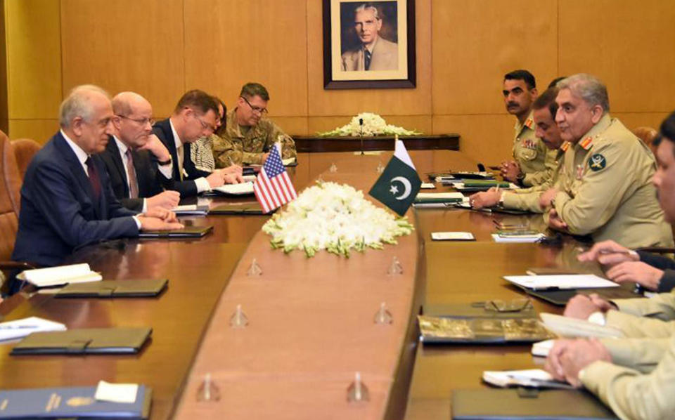 In this photo released by Inter Services Public Relations of Pakistan's military, U.S. peace envoy Zalmay Khalilzad, left, talks with Pakistani Army Chief Gen. Qamar Javed Bajwa, second from right, during a meeting in Rawalpindi, Pakistan, Thursday, Jan. 17, 2019. (Inter Services Public Relations via AP)