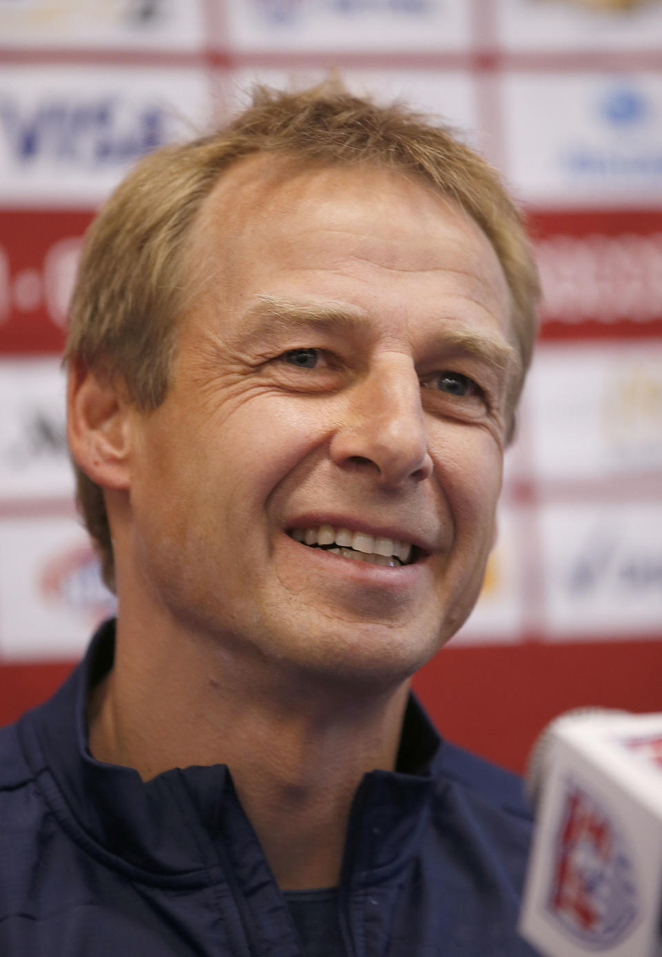 CORRECTS NAME TO KLINSMANN - U.S. Men's National Team Head Coach Jurgen Klinsmannn answers questions during a news conference on Wednesday, May 14, 2014, Stanford, Calif. The US national soccer team kicked off its preparation camp at Stanford University preparing for the World Cup tournament, which gets underway in June. (AP Photo/Tony Avelar)