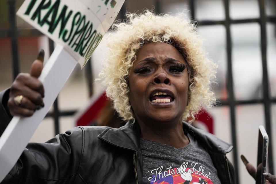 Linda Jones protests with a group of demonstrators outside a police precinct in response to the death of Tyre Nichols, who died after being beaten by Memphis police officers, in Memphis, Tenn., Sunday, Jan. 29, 2023. (AP Photo/Gerald Herbert)