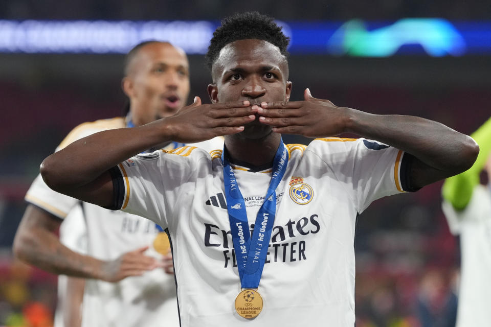 Real Madrid's Vinicius Junior waves after winning the Champions League final soccer match between Borussia Dortmund and Real Madrid at Wembley stadium in London, Saturday, June 1, 2024. (AP Photo/Kirsty Wigglesworth)