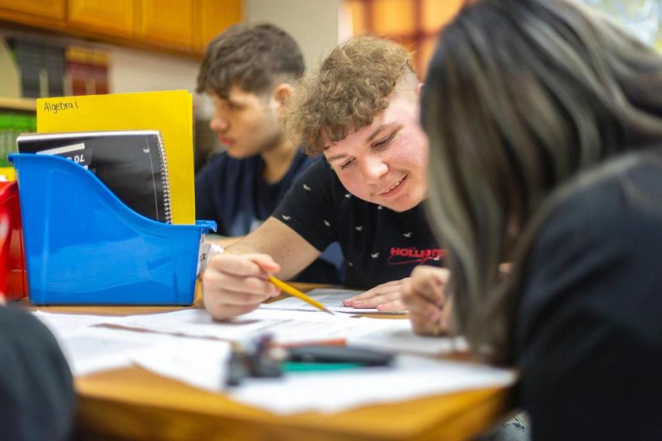 Tyson Prater, a sophomore, at the David School in David, Ky., works on a math assignment on Thursday, Jan. 11, 2024. Located in Floyd County, the school was founded in the early 1970s as an alternative for students at risk of dropping out of public schools.