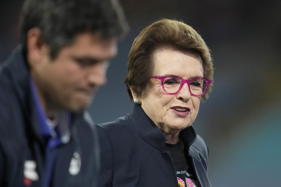 Tennis legend Billie Jean King, right, walks on the pitch ahead of the Women's World Cup soccer final between Spain and England at Stadium Australia in Sydney, Australia, Sunday, Aug. 20, 2023. (AP Photo/Abbie Parr)