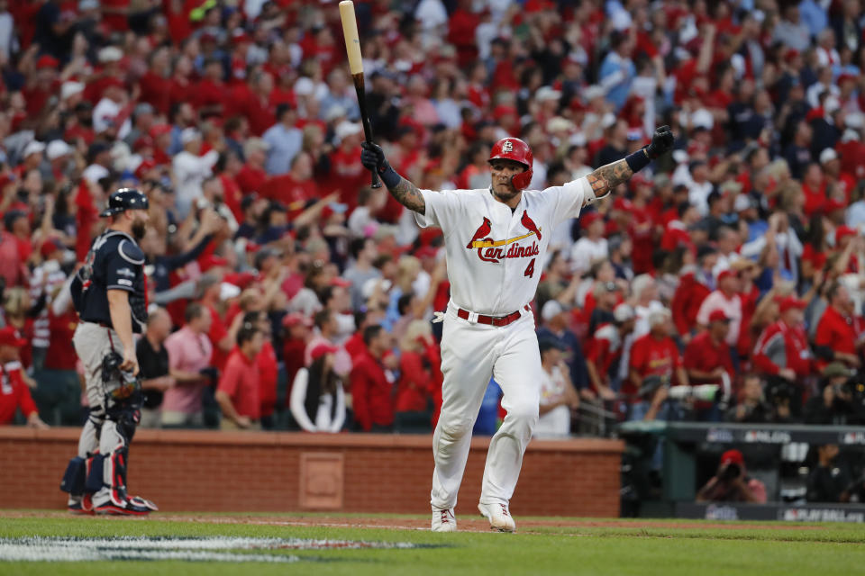 St. Louis Cardinals' Yadier Molina celebrates after hitting a sacrifice fly to score Kolten Wong and defeat the Atlanta Braves in Game 4 of a baseball National League Division Series, Monday, Oct. 7, 2019, in St. Louis. The Cardinals won 5-4. (AP Photo/Jeff Roberson)