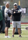 New York Jets general manager Joe Douglas, right, talks with head coach Robert Saleh during NFL football practice Wednesday, July 28, 2021, in Florham Park, N.J. (AP Photo/Adam Hunger)