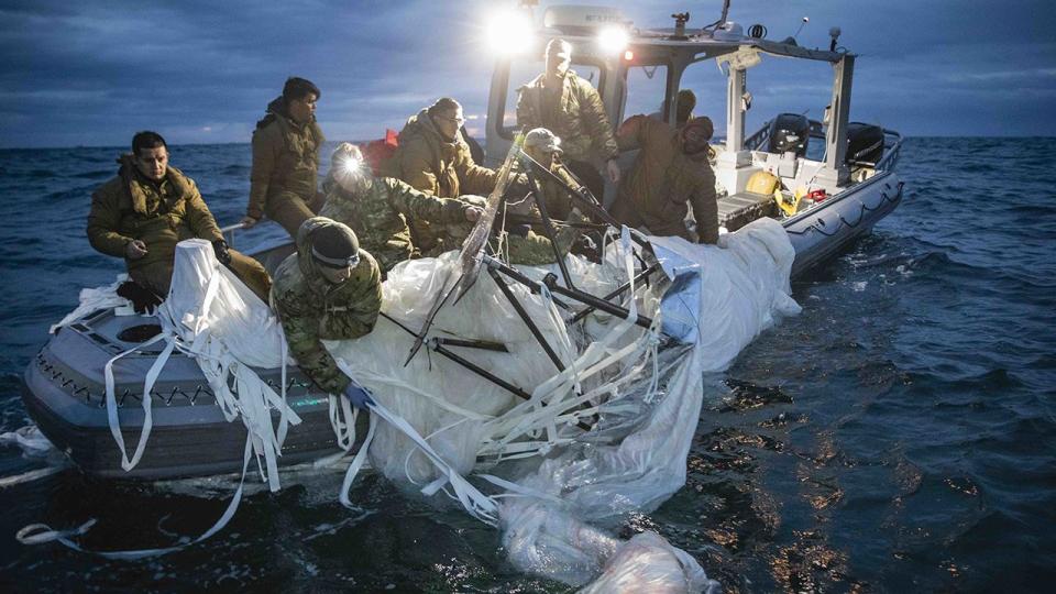 Sailors assigned to Explosive Ordnance Disposal Group 2 recover a high-altitude surveillance balloon off the coast of Myrtle Beach, South Carolina, Feb. 5, 2023. EODGRU 2 is a critical part of the Navy Expeditionary Combat Force that clears explosive hazards to provide access to denied areas; secures the undersea domain for freedom of movement; builds and fosters relationships with trusted partners, and protects the homeland. At the direction of the President of the United States and with the full support of the Government of Canada, U.S. fighter aircraft under U.S. Northern Command authority engaged and brought down a high altitude surveillance balloon within sovereign U.S. airspace and over U.S. territorial waters Feb. 4, 2023.  Active duty, Reserve, National Guard, and civilian personnel planned and executed the operation, and partners from the U.S. Coast Guard, Federal Aviation Administration, and Federal Bureau of Investigation ensured public safety throughout the operation and recovery efforts.