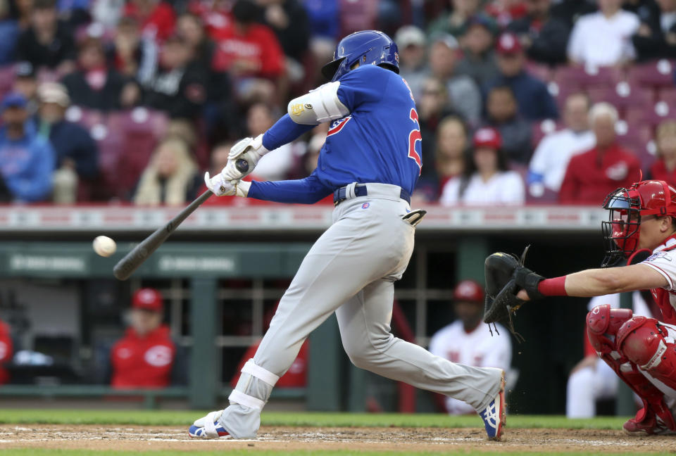 Chicago Cubs' Seiya Suzuki hits a double against the Cincinnati Reds during the fourth inning of a baseball game in Cincinnati, Monday, May 23, 2022. (AP Photo/Paul Vernon)