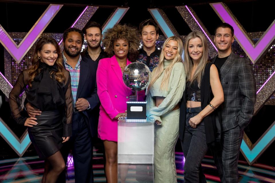 strictly come dancing finalists jowita hamza vito fleur carlos mollie helen and gorka stand round glitterball trophy