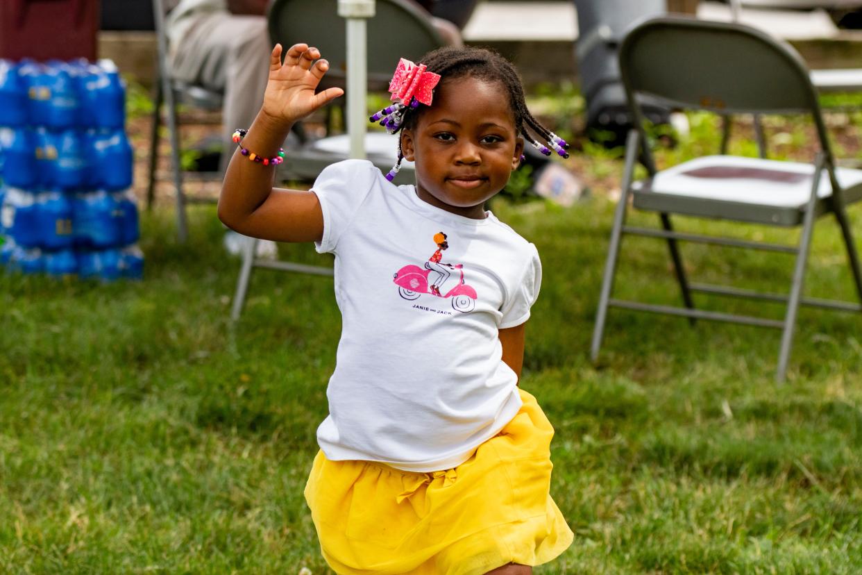 Four-year-old Malena Nelson dances during a performance by Kyle Bledsoe on June 19, 2021, at Tapawingo Park in West Lafayette, Ind. Malana's parents brought her to the celebration to enjoy the first year of Juneteenth as a federal holiday.