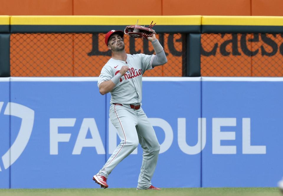 Philadelphia Phillies left fielder Whit Merrifield catches a fly ball hit by Detroit Tigers' Justyn-Henry Malloy during the second inning of a baseball game Tuesday, June 25, 2024, in Detroit. (AP Photo/Duane Burleson)