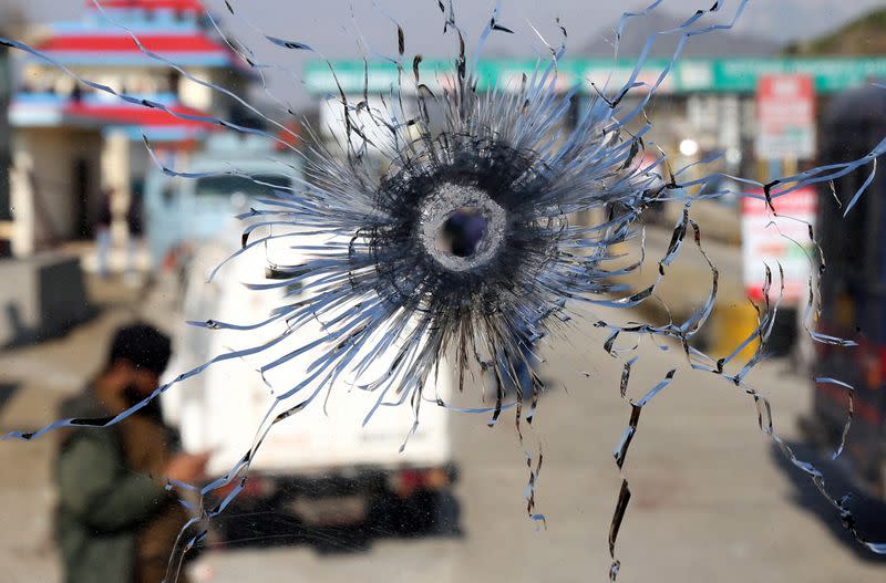 FILE PHOTO: A bullet hole is seen in the windscreen of a truck which was used by suspected militants, at the site of a gun battle at Nagrota, on the outskirts of Jammu