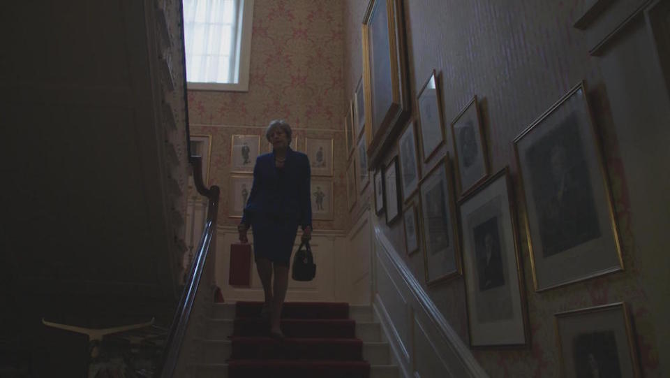 Mrs May walking down the stairs at 10 Downing Street (Picture: BBC/PA)