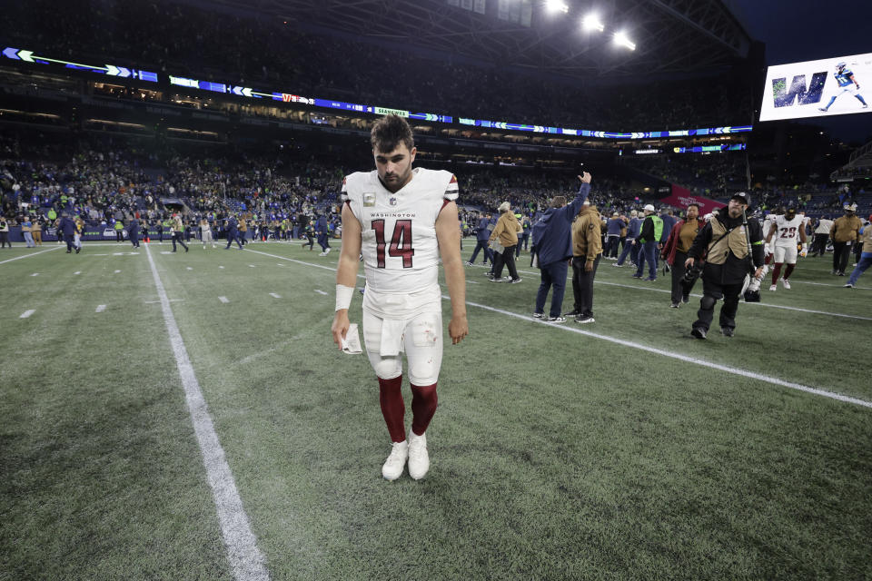 Washington Commanders quarterback Sam Howell (14) walks off the field after an NFL football game against the Seattle Seahawks in Seattle, Sunday, Nov. 12, 2023. (AP Photo/John Froschauer)