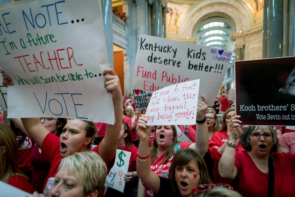 In this Friday, April 13, 2018 photo, teachers from across Kentucky gather inside the state capitol in Frankfort during a rally for increased education funding. Americans overwhelmingly believe teachers don't make enough money, and half say they'd support paying higher taxes to give educators a raise. (Photo: ASSOCIATED PRESS)