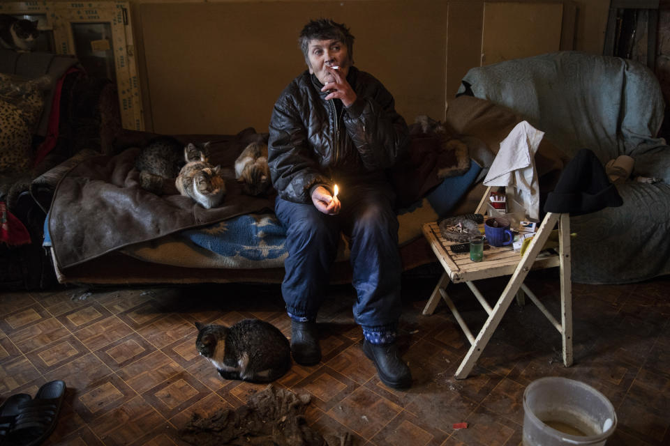 <span class="s1">Ludmyla Vasilevna, age 61, lives alone with her cats and a few dogs in the village of Avdiivika, very close to the contact line, where most have left due to the danger. Her son is in the Donetsk People’s Republic military. Her house has been damaged over the years, but she refuses to leave as she has nowhere else to go. (Photograph by Paula Bronstein)</span>