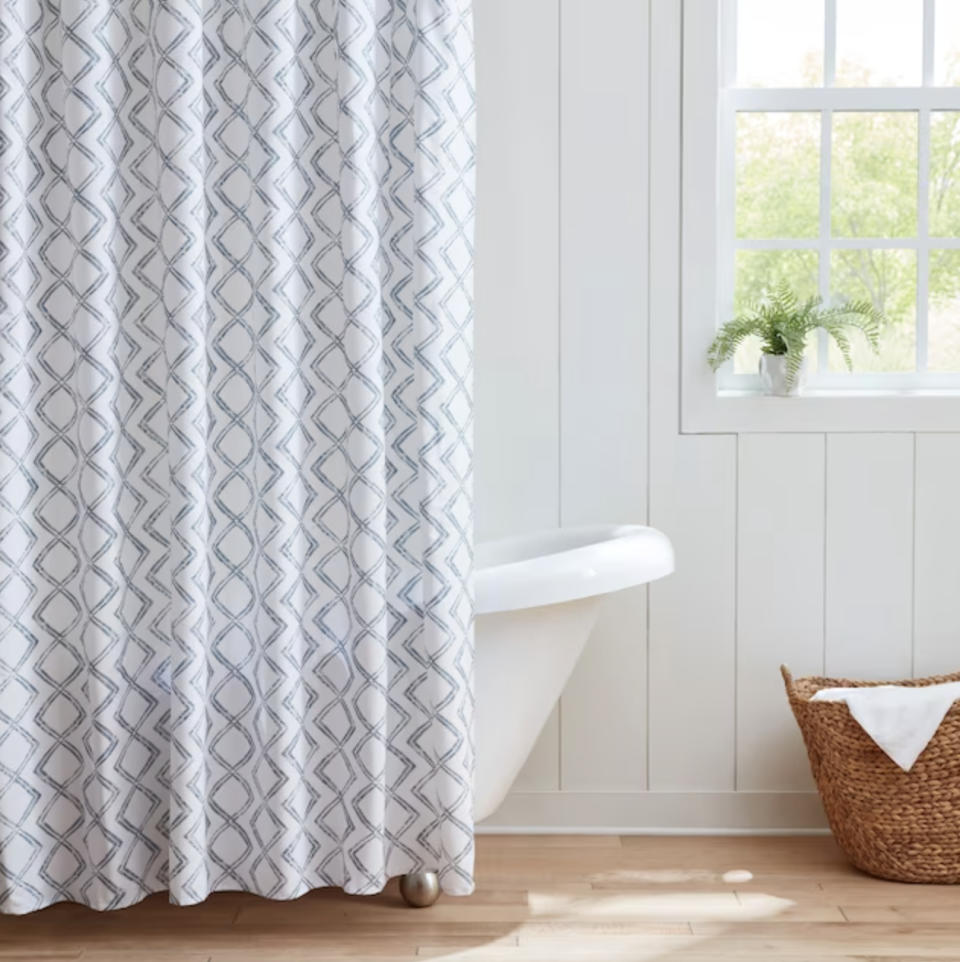 shower curtain installed above bathtub