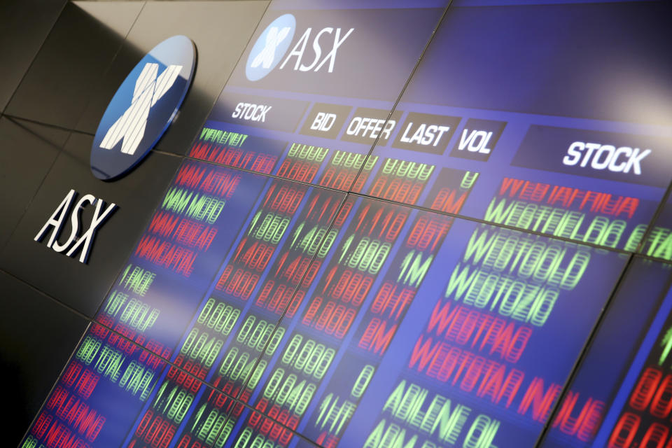 A display board at the Australian Stock Exchange changes listings in Sydney, Wednesday, Feb. 7, 2018. Major indexes in Asia and Europe Tuesday took steep losses and U.S. markets started sharply lower, only to repeatedly change direction. (AP Photo/Rick Rycroft)