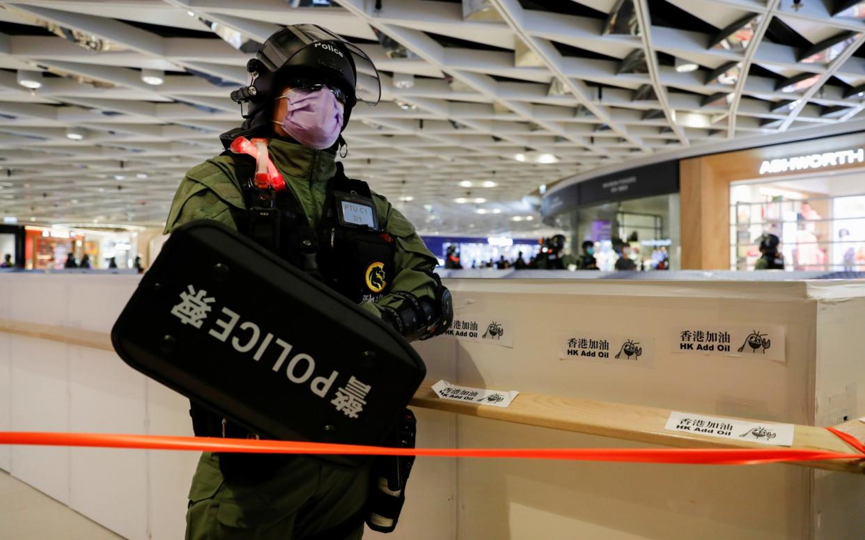 Riot police during a protest - REUTERS